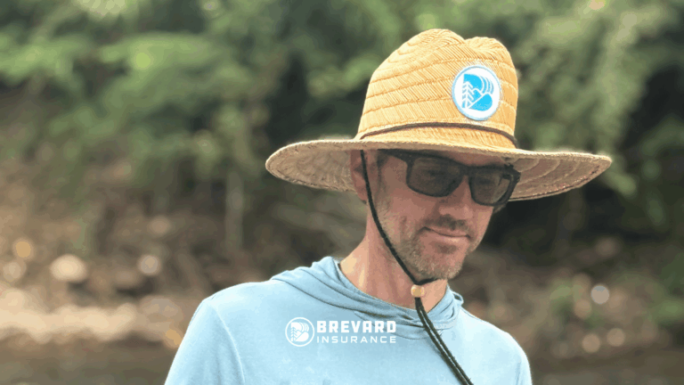 man in a hat by a river
